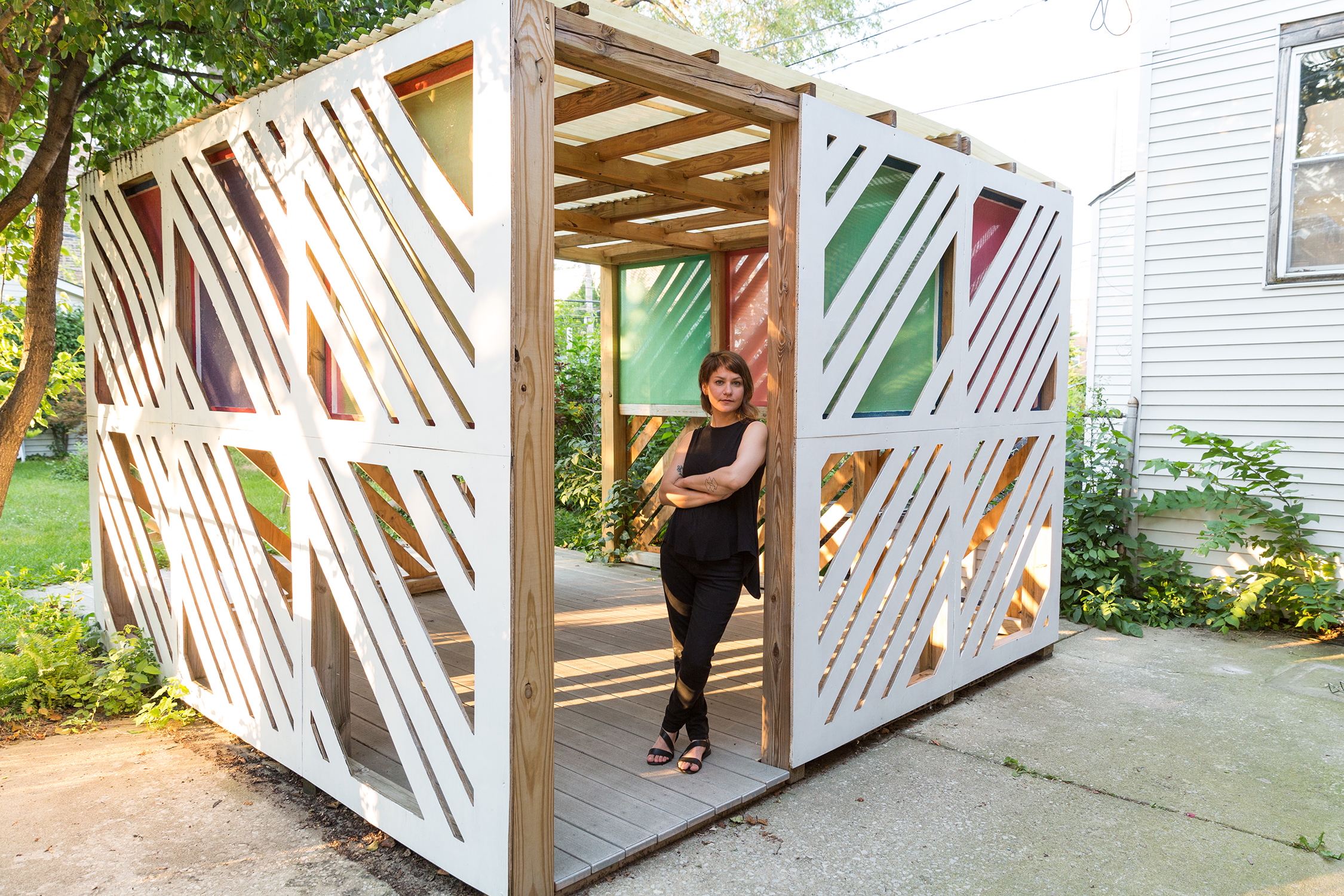 Loyola Teaching Assistant Gina Hunt standing in a wooden structure Loyola Teaching Assistant Gina Hunt standing in a wooden structure
